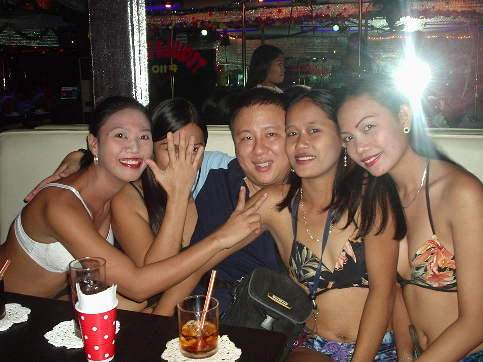 Photo shows Filipina bar girls NOT cold or business-like.